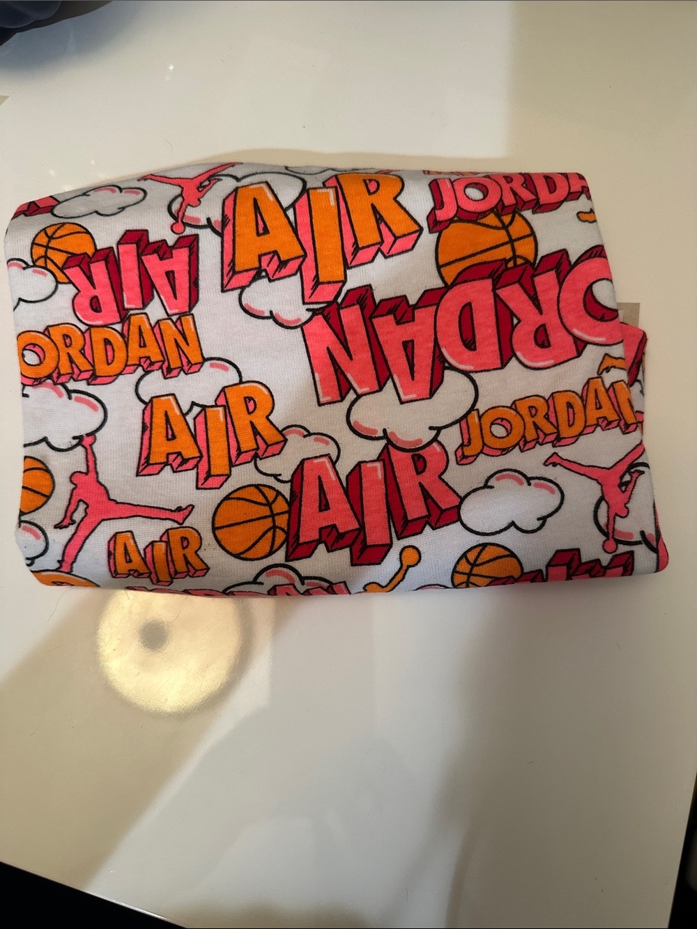 Nike Air Jordan baby blanket, an all-over basketball and brand logo graphic, New